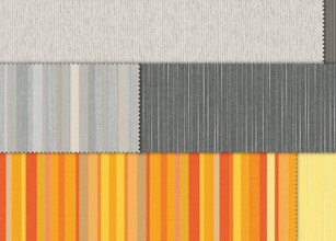 Stofrollen in verschillende kleuren en patronen, waaronder groen, blauw, geel en bruin. 