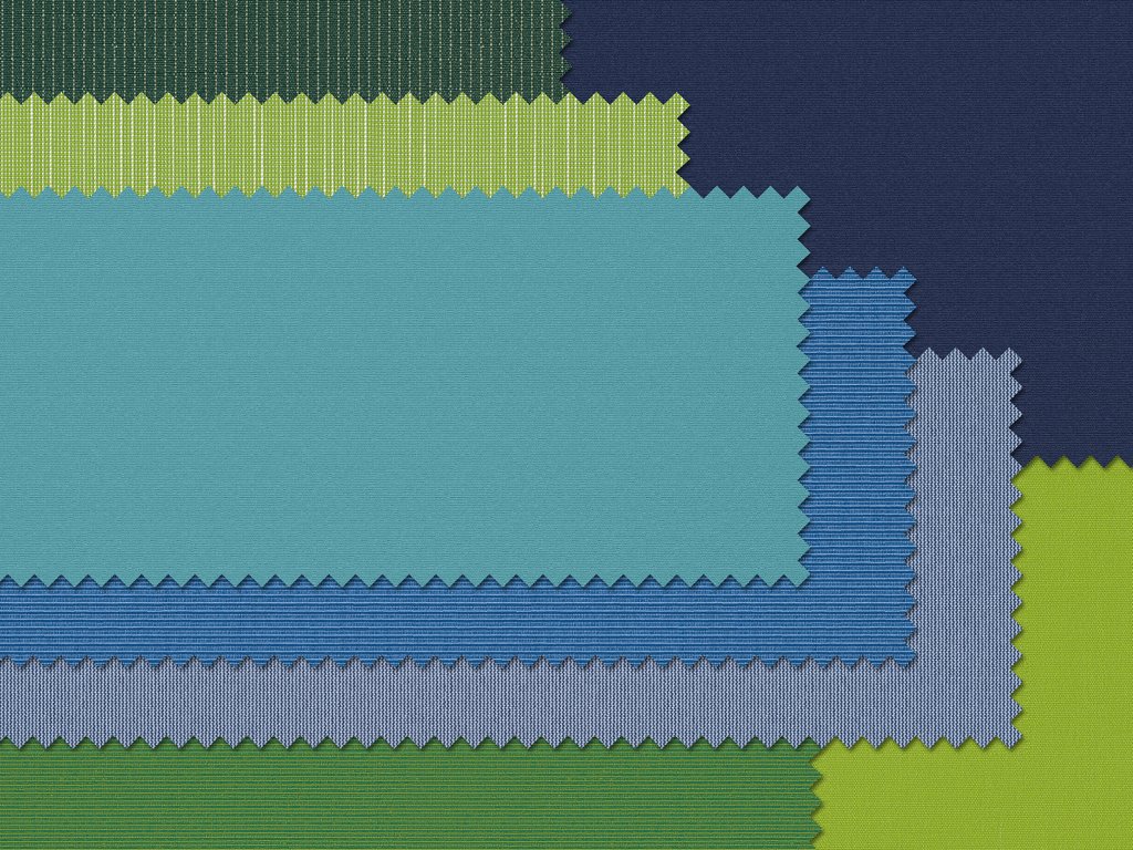 Farbenfrohe Stoffmuster in unterschiedlichen grünen und blauen Tönen mit gezackten Kanten. Farbenfrohe Stoffmuster in unterschiedlichen grünen und blauen Tönen mit gezackten Kanten.
