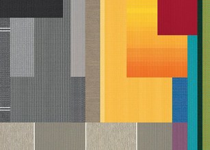 A patchwork of various textures and colours, including yellow, red, orange, green, and grey. 