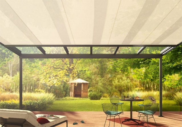 A modern terrace with a pergola, featuring a light-coloured canopy and garden surroundings. A modern terrace with a pergola, featuring a light-coloured canopy and garden surroundings.