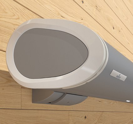 A grey elongated casing with a rounded design against a wooden background.