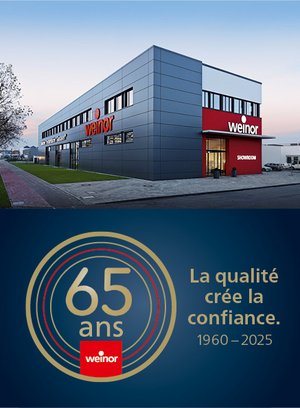 Bâtiment moderne avec des éléments gris et rouge, célébrant 65 ans d'existence.