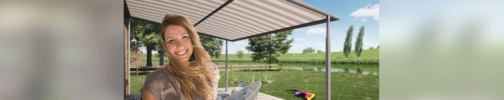 A smiling woman under a pergola with a striped awning, surrounded by greenery and a serene landscape. A smiling woman under a pergola with a striped awning, surrounded by greenery and a serene landscape.